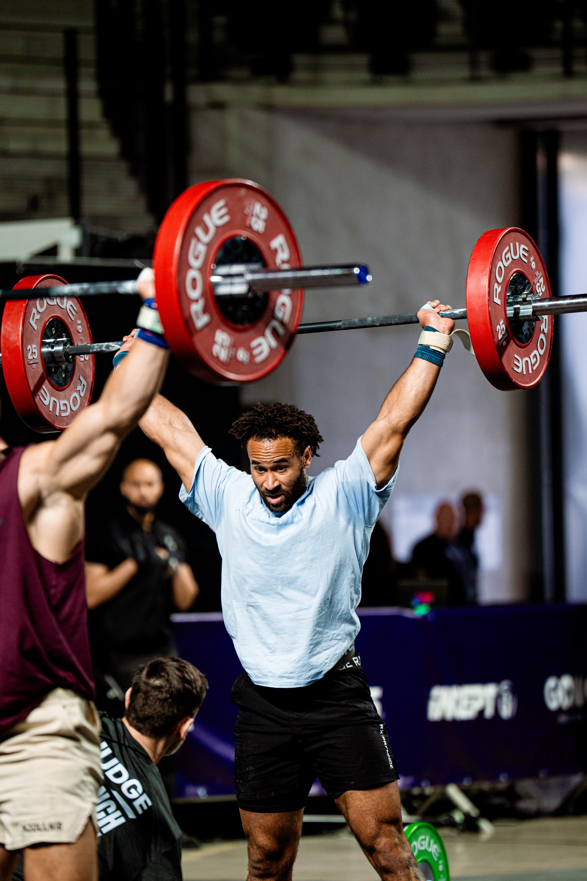 Athlete overhead barbell at competition